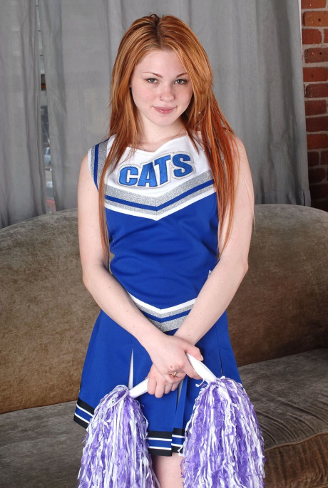 Redheaded cheerleader Jamie flaunts her melons and rubs her vagina in her uniform - #266890