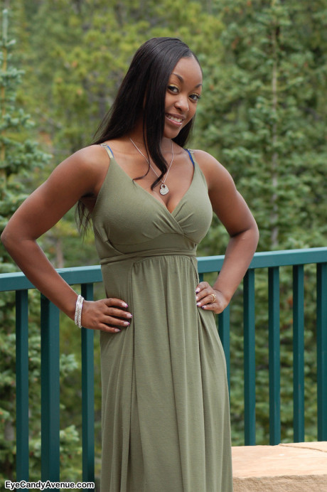 Ebony amateur Amber releases her giant boobies from a long dress on a balcony - #100197