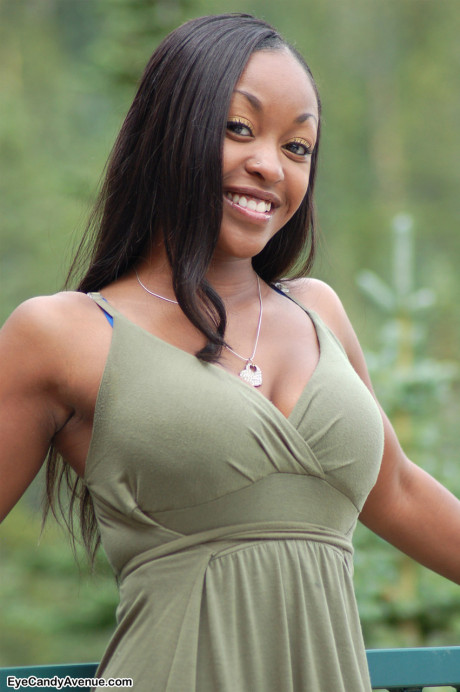 Ebony amateur Amber releases her giant boobies from a long dress on a balcony - #100199