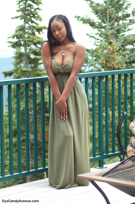 Ebony amateur Amber releases her giant boobies from a long dress on a balcony - #100206