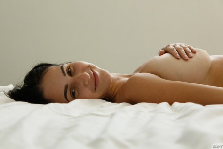 Brunette bombshell Dita Vetone teases with her huge titties on her bed - #170753