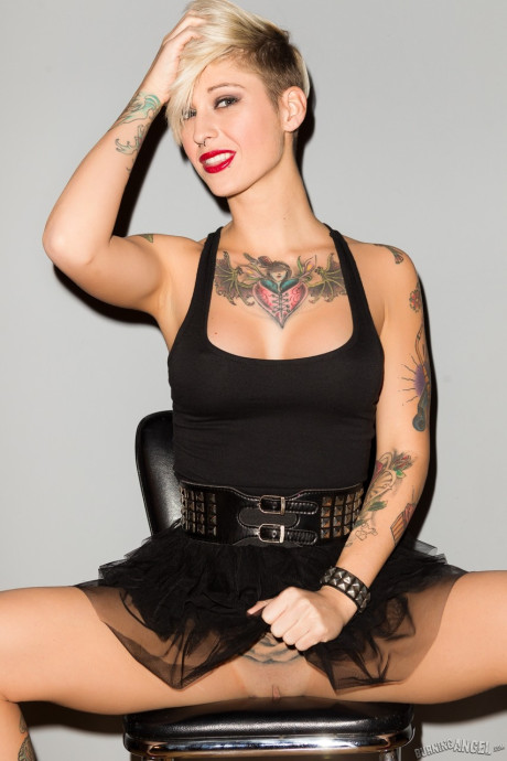 Tattooed female Kleio Valentien slips out of her ebony dress for undressed poses - #91137