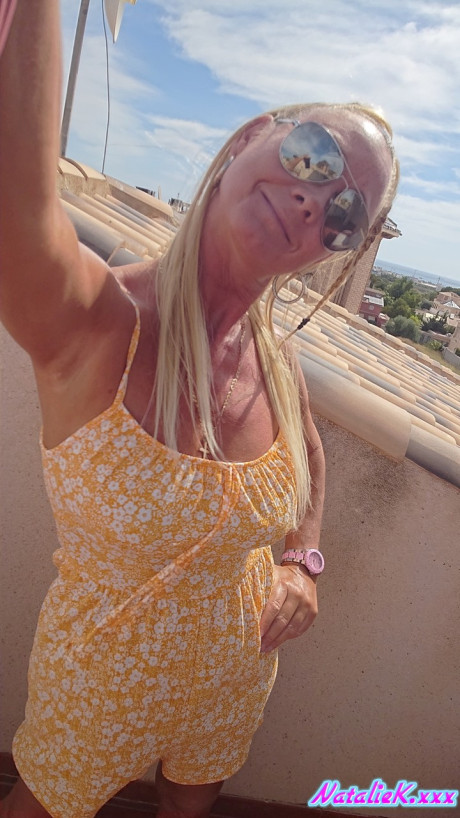 Cougar Spanish pornstar Natalie K unveiling her giant juicy tits on the balcony - #166818