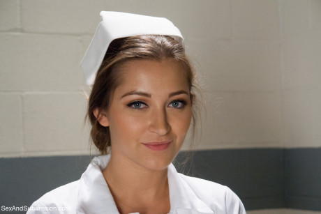 Beautiful nurse with a nice behind Dani Daniels strips and poses in high heels - #255679