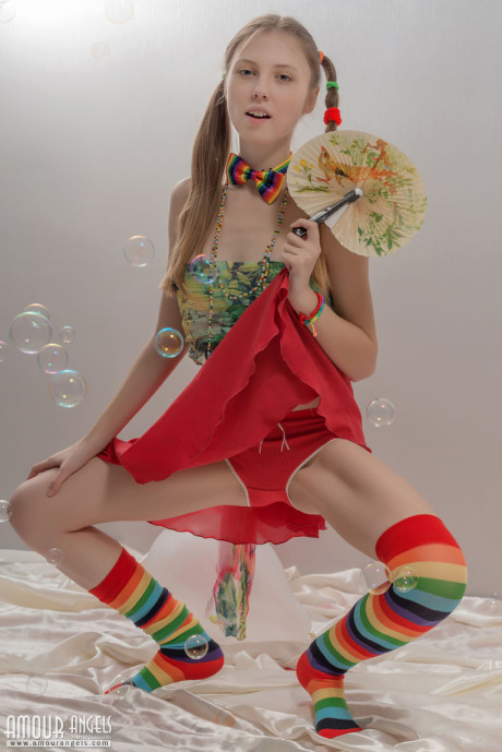 Thin young lady gf chick in pigtails and multi-colored socks takes off her clothes - #2259