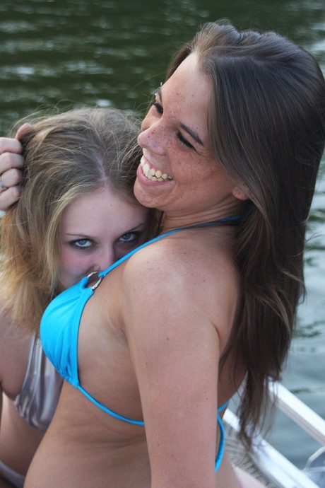 Two smoking hot lesbian teens in cute bikinis scissoring on a boat - #98288