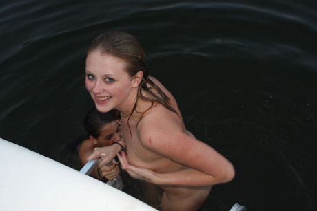Two smoking hot lesbian teens in cute bikinis scissoring on a boat - #98305