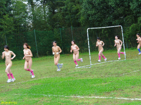Oriental female football team watches as a teammate gets nailed by the referees #2308