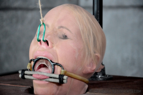 Blondy female Simone Sonay is rendered helpless in a basement vault #10076