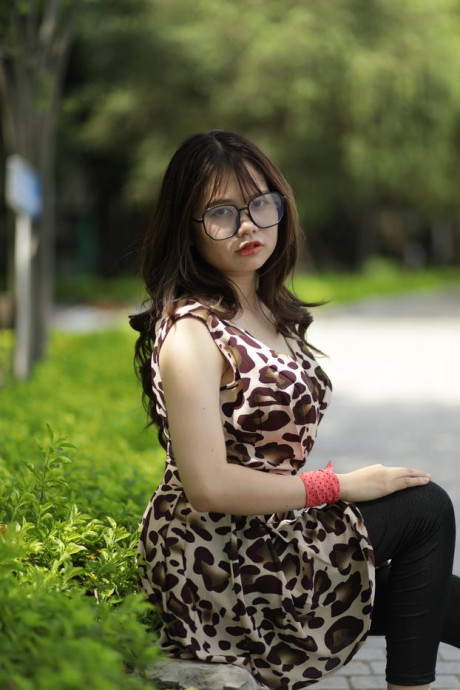 Sweet solo whore gf girl displays her cleavage while seated on a curb in the outdoors - #296509