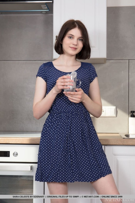 Short haired teenie removes her dress to model naked in a kitchenette - #310656