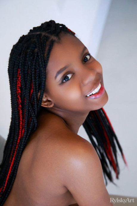 Gorgeous ebony young Sukki T peels off her thong to get bareback nude