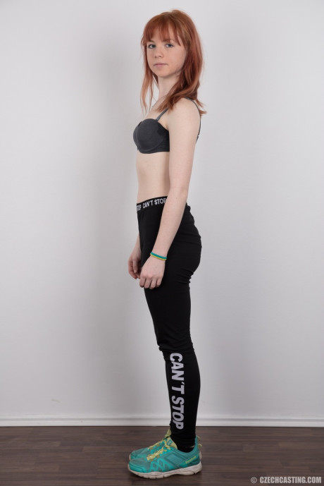 Attractive redhead amateur uncovers her barely budding boobs as she gets naked #10744