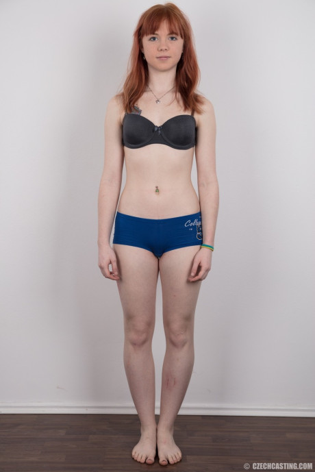 Attractive redhead amateur uncovers her barely budding boobs as she gets naked - #196671