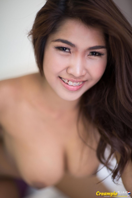 Pretty chinese young Tittiporn teases with her large titties on her bed - #315069