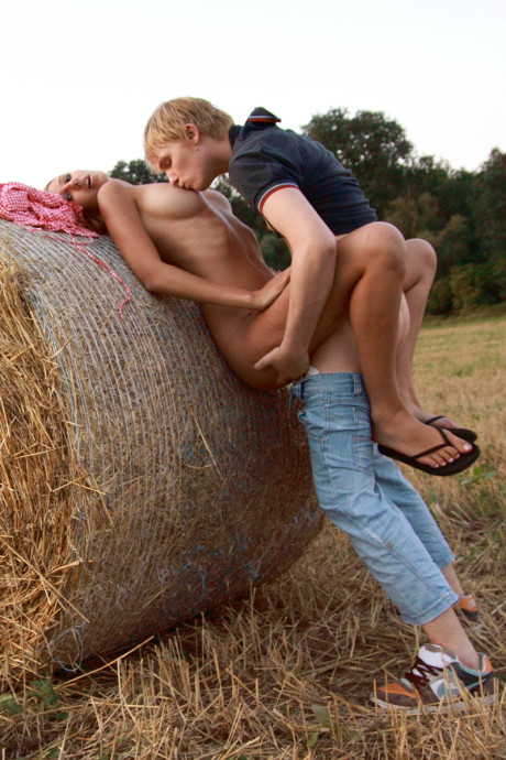 Fresh teenie couple Kitty Jane & Augustin have sex in a field against a round bale - #71021