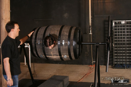 Lovely brunette in a bondage box Goldie giving head to a brutal BDSM handler - #128335