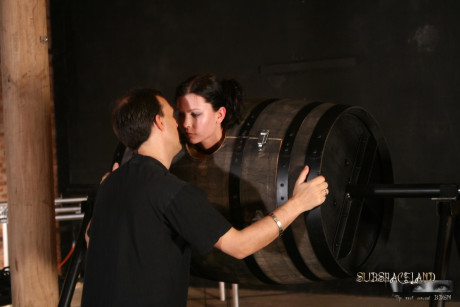Lovely brunette in a bondage box Goldie giving head to a brutal BDSM handler #7079