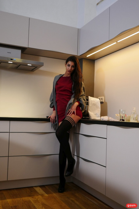 Tall brunette Coco Kiss does a hot tease wearing stockings & high heels - #197189