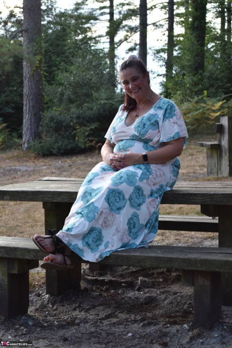 Old BBW removes a dress before uncovering her natural breasts in the woods - #294065