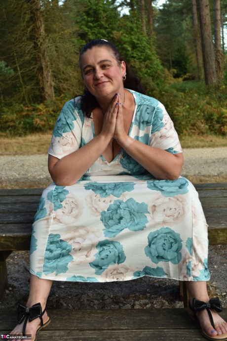 Old BBW removes a dress before uncovering her natural breasts in the woods - #294068