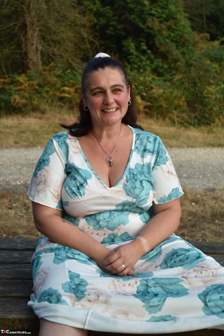 Old BBW removes a dress before uncovering her natural breasts in the woods - #294071