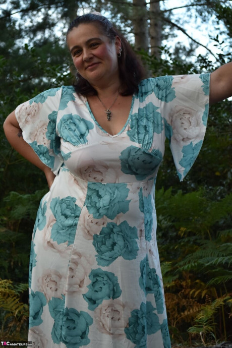 Old BBW removes a dress before uncovering her natural breasts in the woods - #294073
