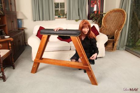 Redheaded trans woman gets tied to a stool in a black skirt and stockings - #313595