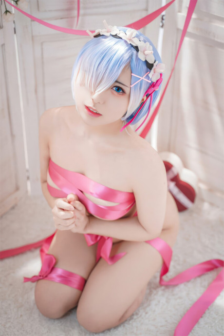 Gorgeous oriental model with enormous breasts poses while wrapped in pink satin ribbon - #62946