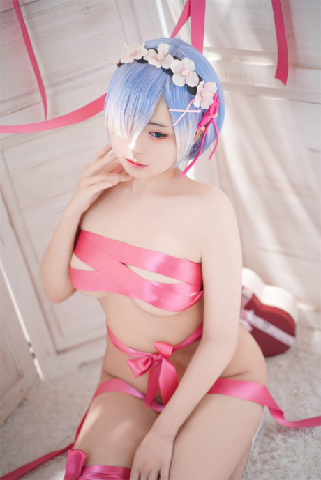 Gorgeous oriental model with enormous breasts poses while wrapped in pink satin ribbon - #62954