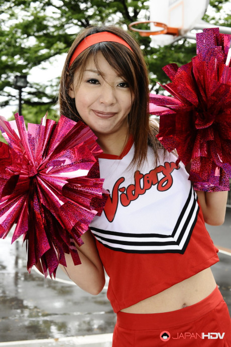 Japanese cheerleader Tomomi Matsuda gives a demonstration at a playground - #190892