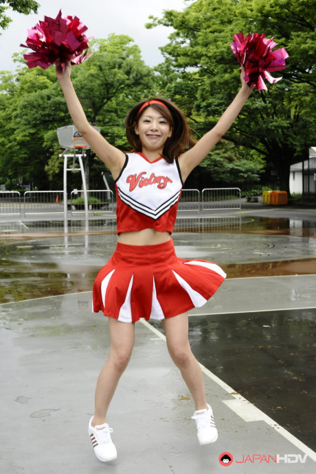 Japanese cheerleader Tomomi Matsuda gives a demonstration at a playground - #190898