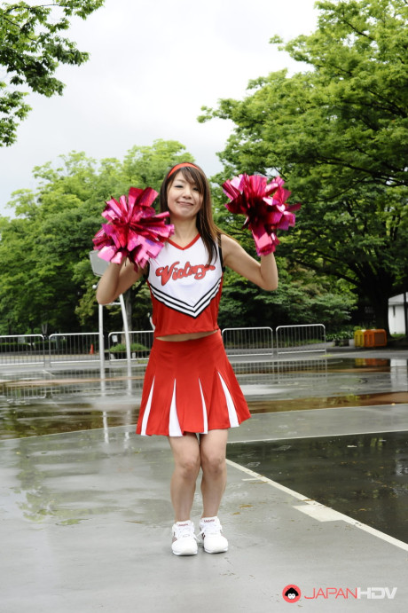Japanese cheerleader Tomomi Matsuda gives a demonstration at a playground - #190899