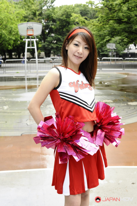 Japanese cheerleader Tomomi Matsuda gives a demonstration at a playground - #190901