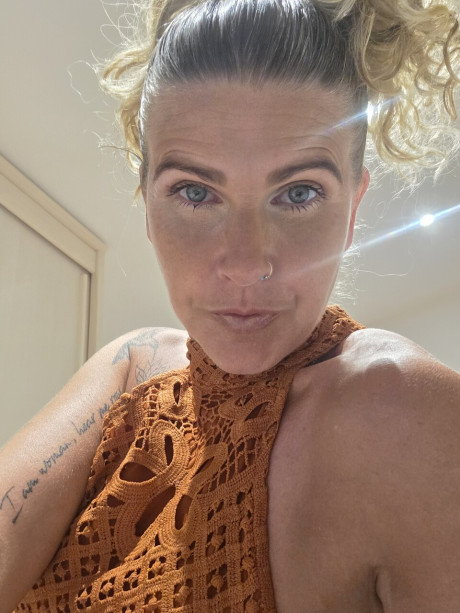 Solo bitch GF broad shows off her tattoos while taking selfies in a halter dress - #294534