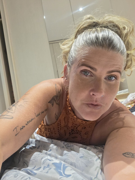 Solo bitch GF broad shows off her tattoos while taking selfies in a halter dress - #294537