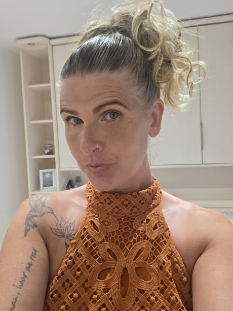 Solo bitch GF broad shows off her tattoos while taking selfies in a halter dress - #294541
