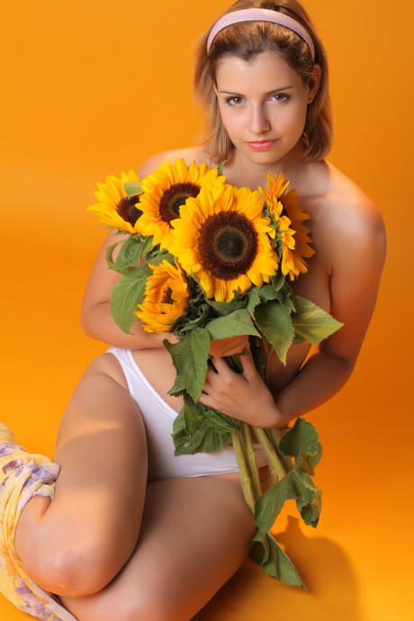 Sexy young sweetie Vienna flaunts her monstrous breasts and poses with sunflowers - #292494