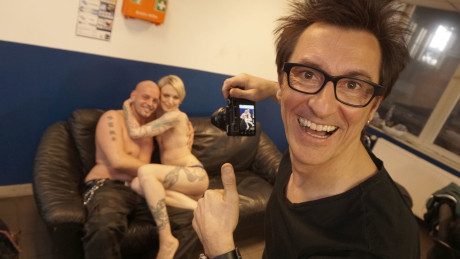 Tattooed slut Conny Dachs gets sandwiched by two perverts on the sofa - #297977