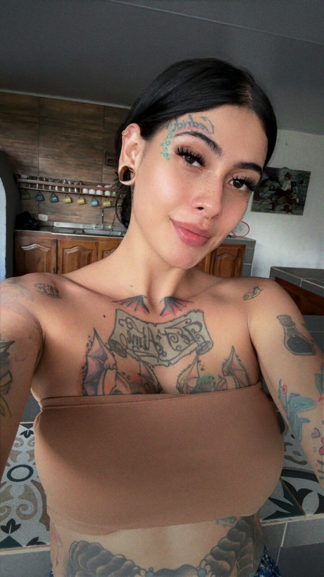 Brunette amateur shows her tattooed body while wearing a short denim skirt - #293894