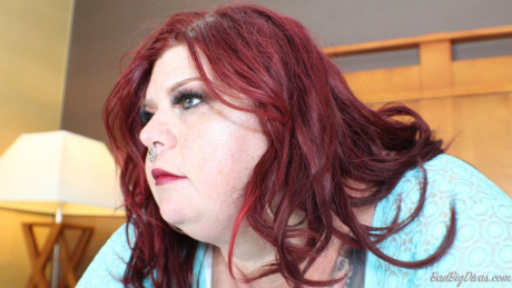 Redhead SSBBW Nikki Cakes shows her monstrous butt while face down on a bed #9848