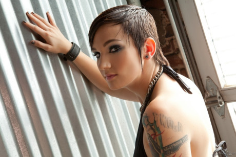 Short haired emo babe strips off and shows her smooth tattooed body - #59362
