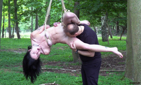 Undressed brunette Crystal Cherry gives a blowjob after being flogged in the woods - #214186