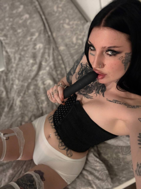 Tattooed female with long black hair engages in a masturbation session - #313118