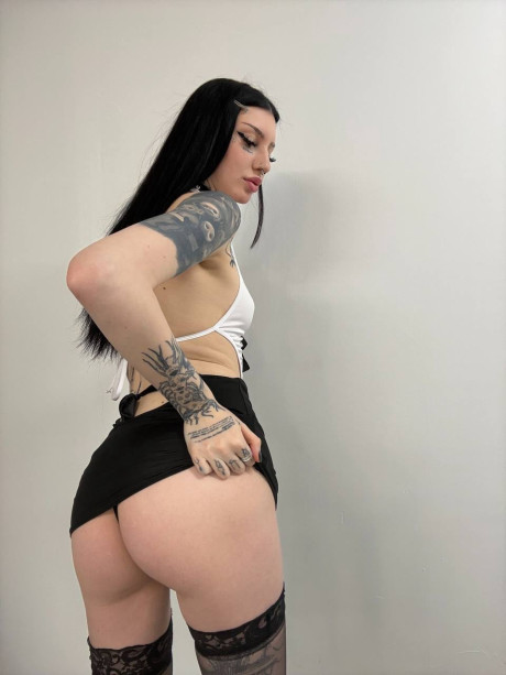 Tattooed female with long black hair engages in a masturbation session - #313120