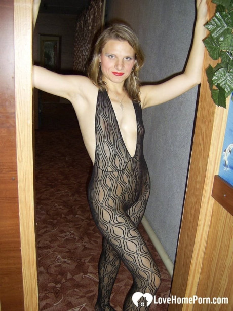 Dirty housewife with red lipstick poses in her bodystocking while vacuuming - #320686
