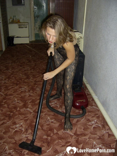 Dirty housewife with red lipstick poses in her bodystocking while vacuuming - #320701