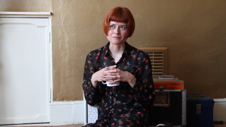 Skinny ginger head Enne toys her silky snatch while nude by a window in a solo #17648