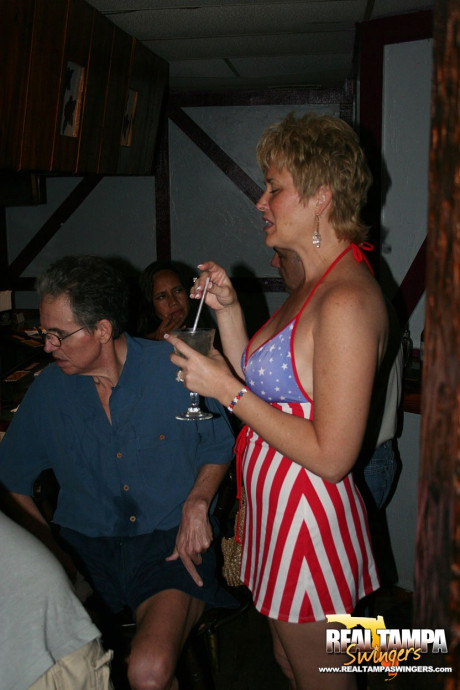 Playful amateur mature swinger wives teasing and French kissing at a party - #153893