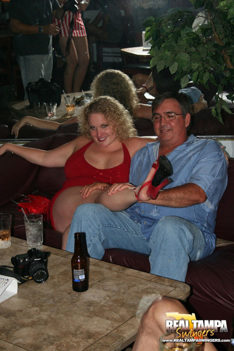 Playful amateur mature swinger wives teasing and French kissing at a party - #153897